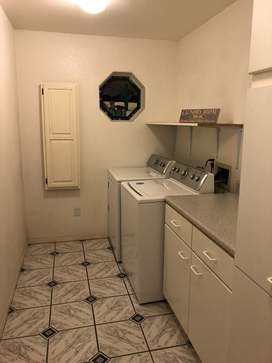Laundry room with built in ironing board