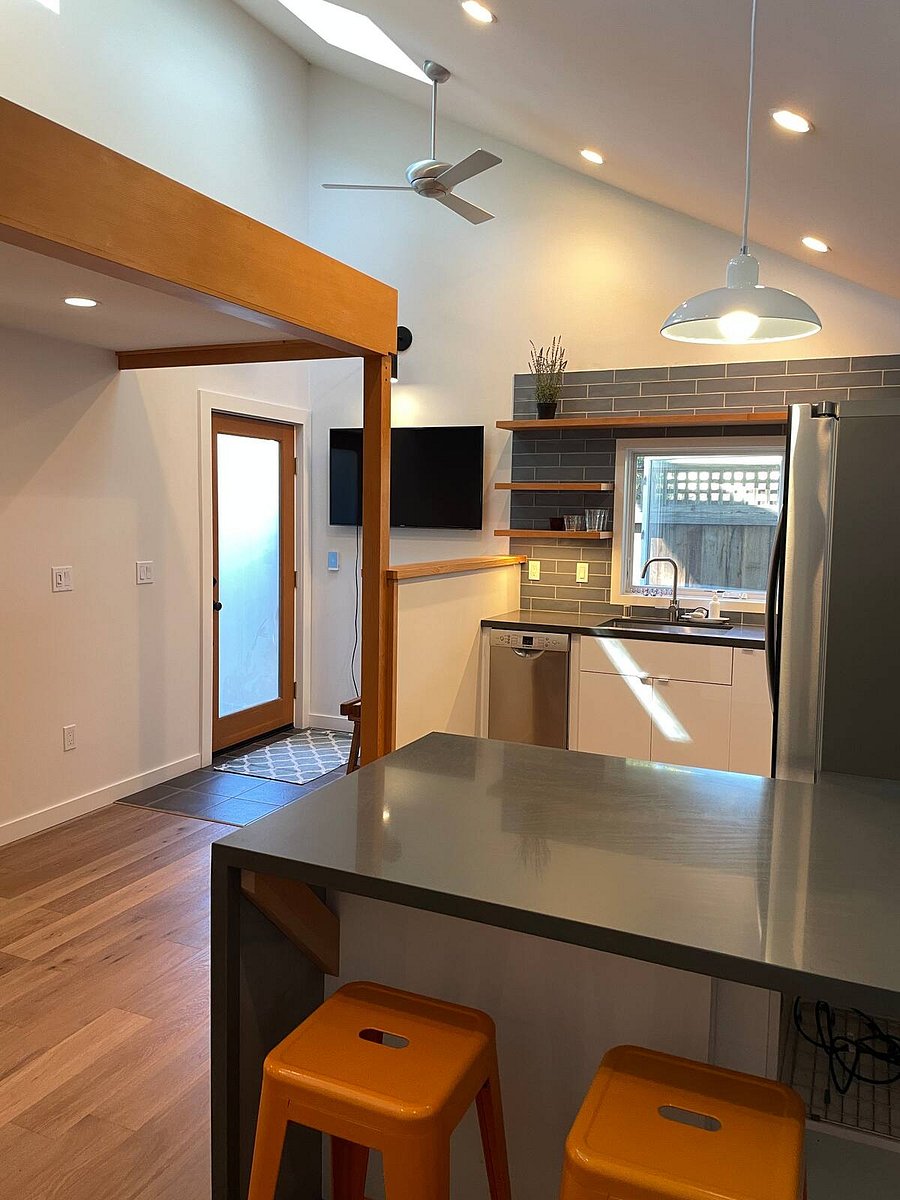 The kitchen & living room area has a granite peninsula counter for work/eating with a pop-up USB-C, power and ethernet connection. The open floor plan allows for cooking, eating, working and watching your favorite movie on the large Samsung smart TV.
