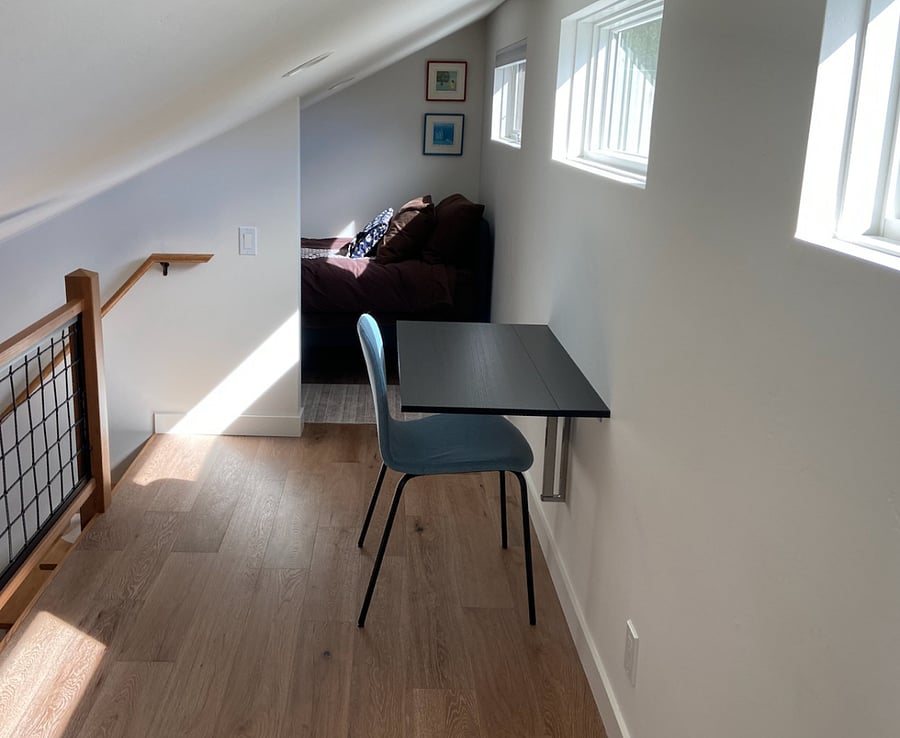 A twin size bed in the sleeping loft area can be considered an extra bedroom. A small desk and chair for a sunny place to do your writing. Dedicated closet and clothes storage on the first floor.