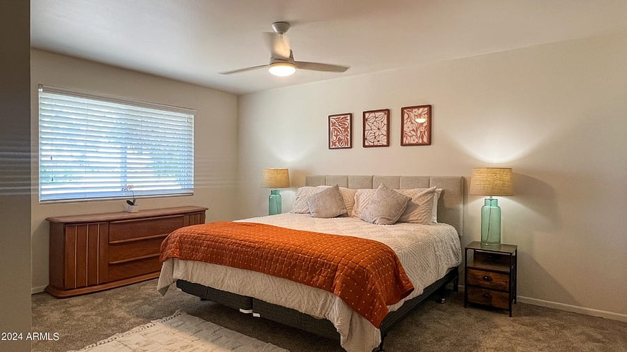 Master bedroom with king bed, dresser & closet
