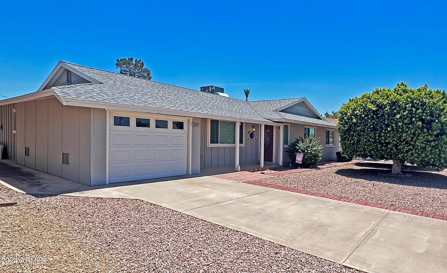 West facing front of the house & single car garage with opener