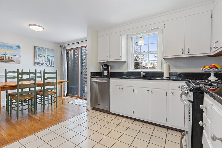 Dining room & kitchen with view of backyard and porch