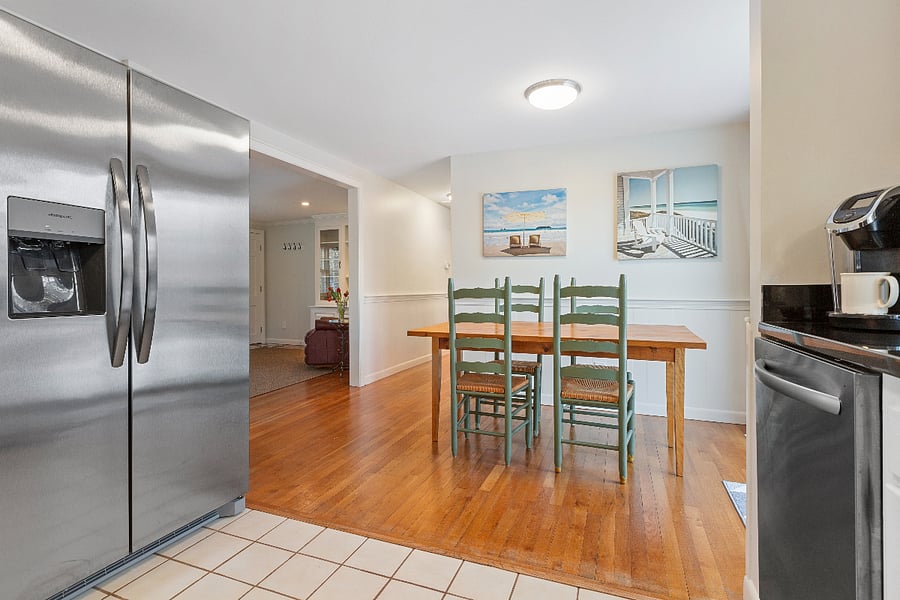 Kitchen w/ brand new Refrigerator and Dining room
