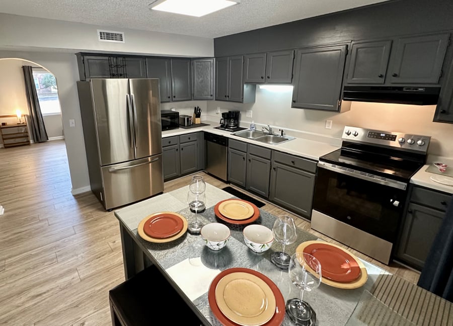 Full size refrigerator, electric range, microwave, toaster, coffee pot and cookware. 