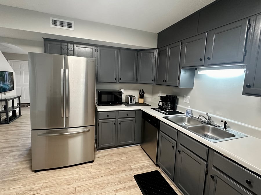 Full size refrigerator, electric range, microwave, toaster, coffee pot and cookware. 