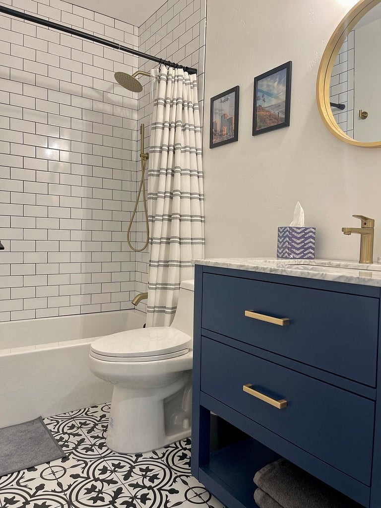 Guest bathroom. Shower over bathtub.