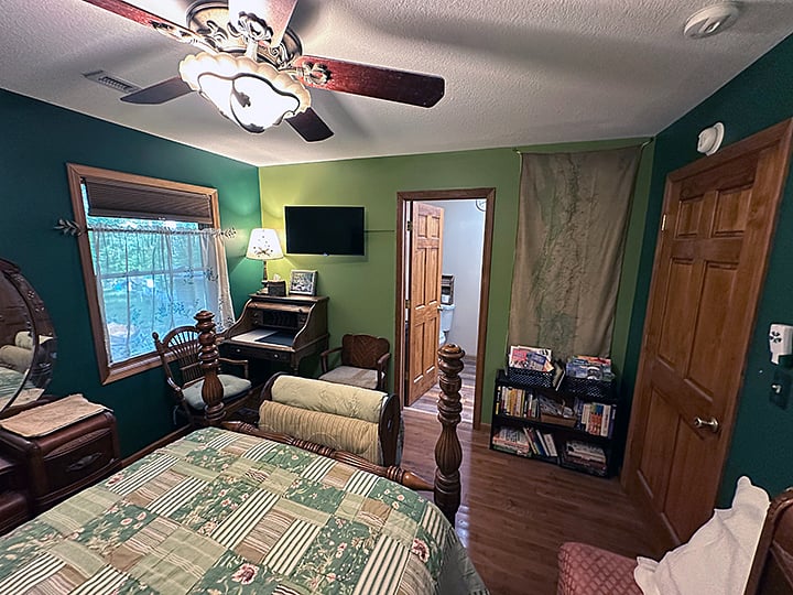 Attached bathroom with shower and walk in closet.