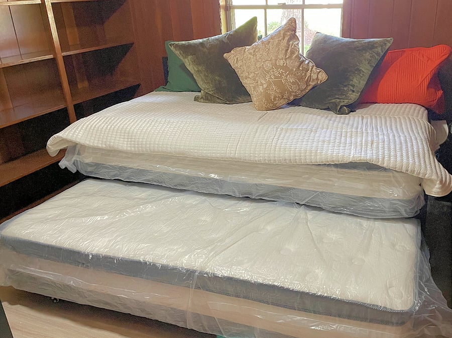 Daybed with trundle includes two full-sized twin mattresses