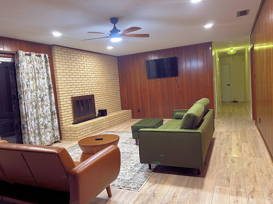 Large family room with access to screened porch. Plenty of room for friends and family.