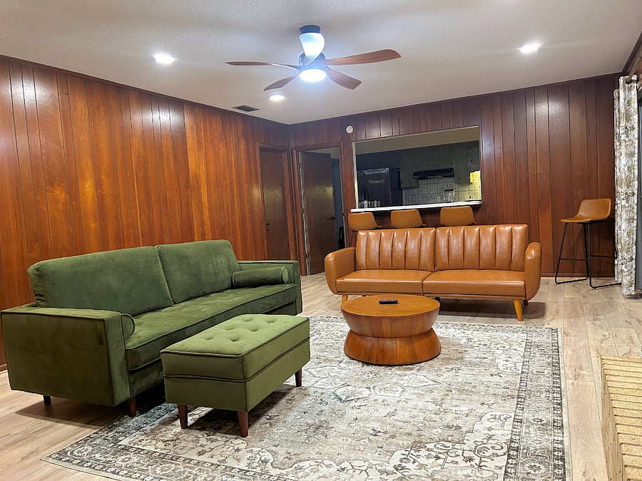 Family room has plenty of space to gather. Kitchen counter easily seats four