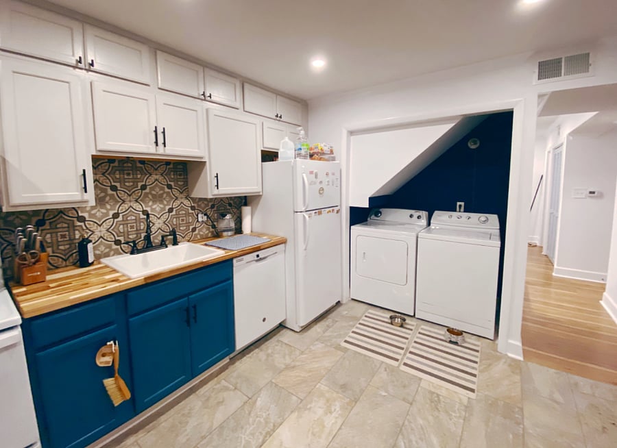 Kitchen with all necessary equipment including washer and dryer   