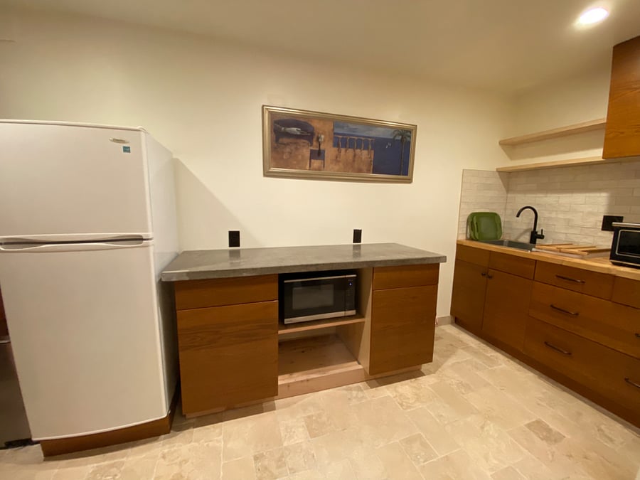 Full fridge/freezer, Panasonic Inverter Microwave, custom concrete countertop, Duxtop induction burner, Nespresso machine, rice cooker, electric kettle. Full kitchen sink.