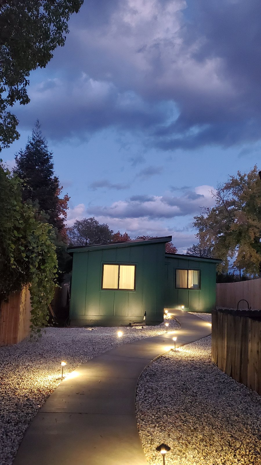 Beautiful evening view of lit up pathway.