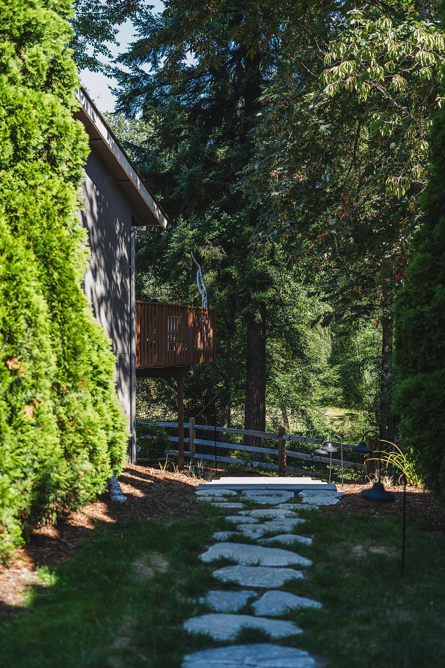 Paved Path and stairs curve around to your apartment.