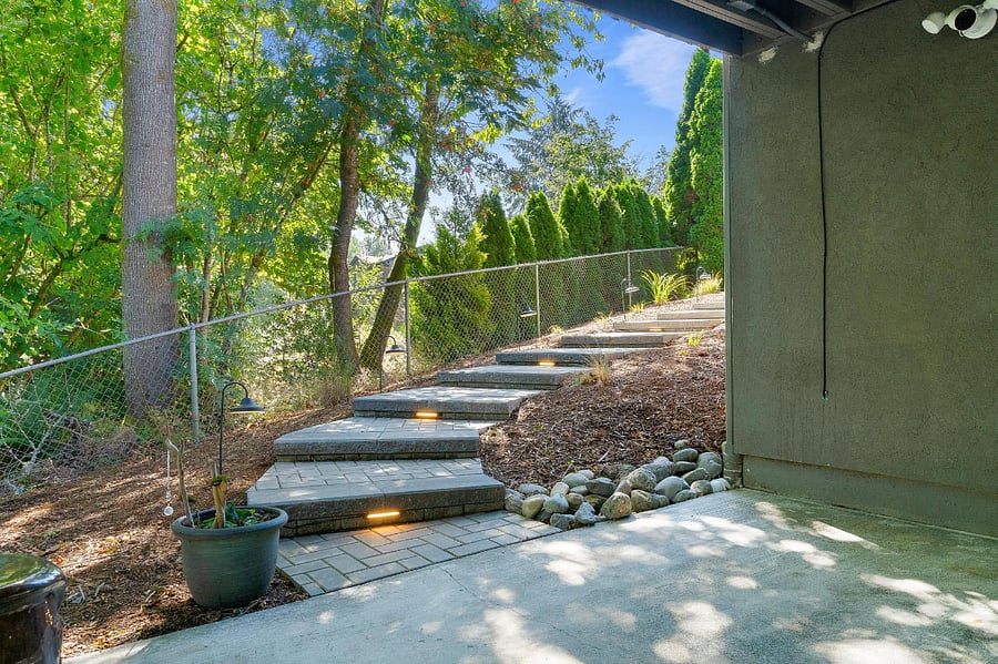 Lit stairs on the path back up to the driveway.