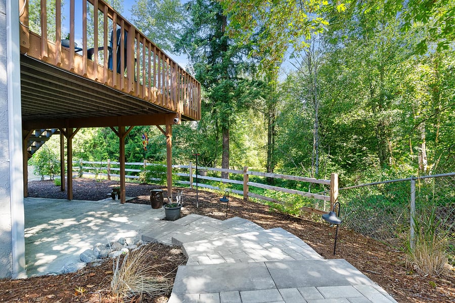 Look out over the woods as you come down the stairs. The apartment is under the main house deck.