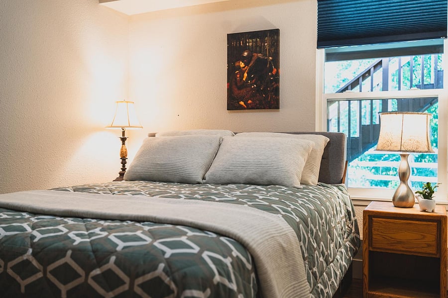 Brand new mattress, plump pillows, and cozy bedding make for a great night's sleep.