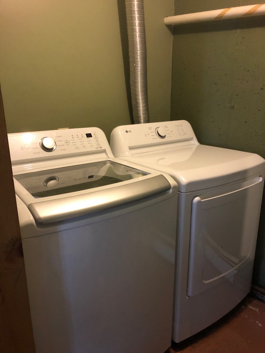 Washer dryer room with sink and toilet. Laundry chute from top and main level.