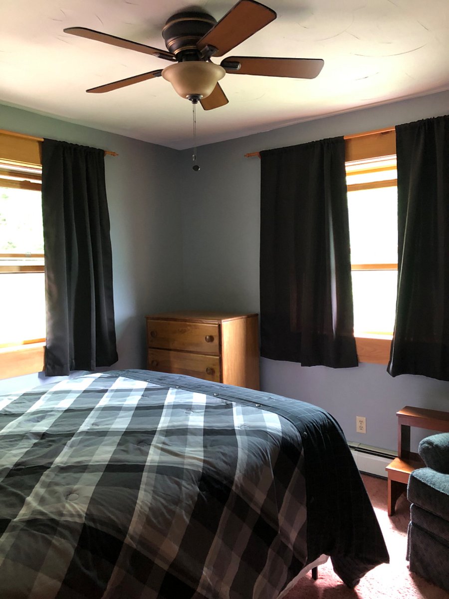 Upstairs bedroom with queen bed in large closet