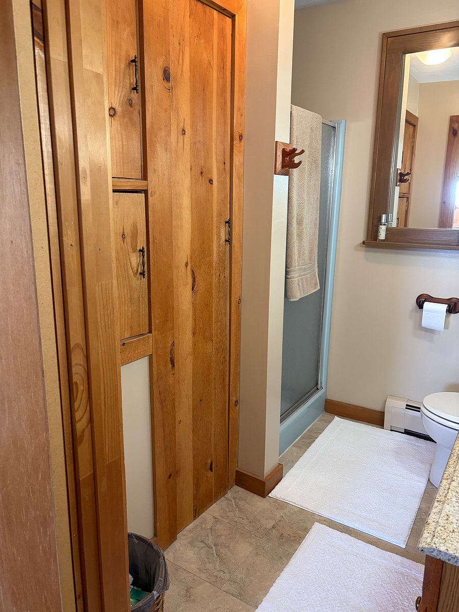 Second level, shower, linen closet, and laundry chute