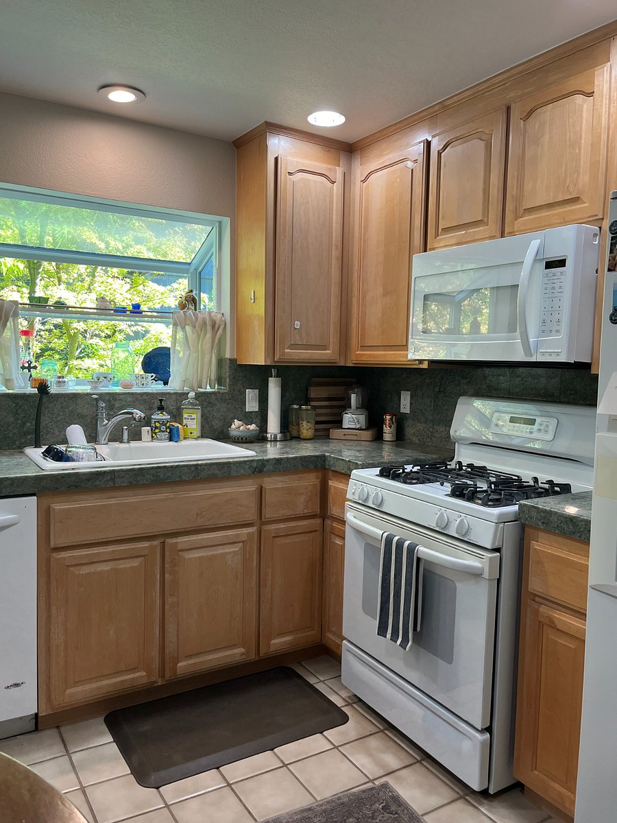 Fully stocked "cook's kitchen" includes gas range and microwave.