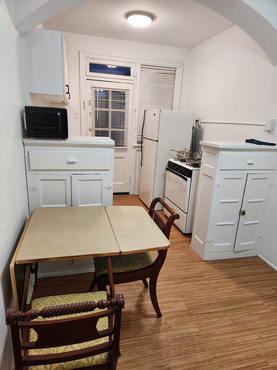 Kitchen with utensils and pot and pans.