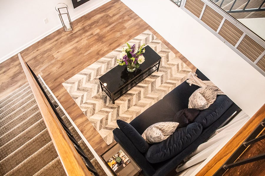 View of living room from second floor. Upstairs/ bedroom is open loft space.