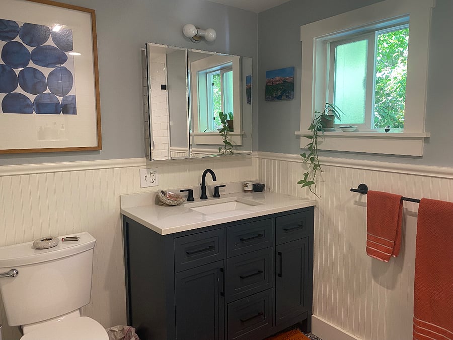 The shared bathroom was recently renovated and comes with a large, modern shower.
