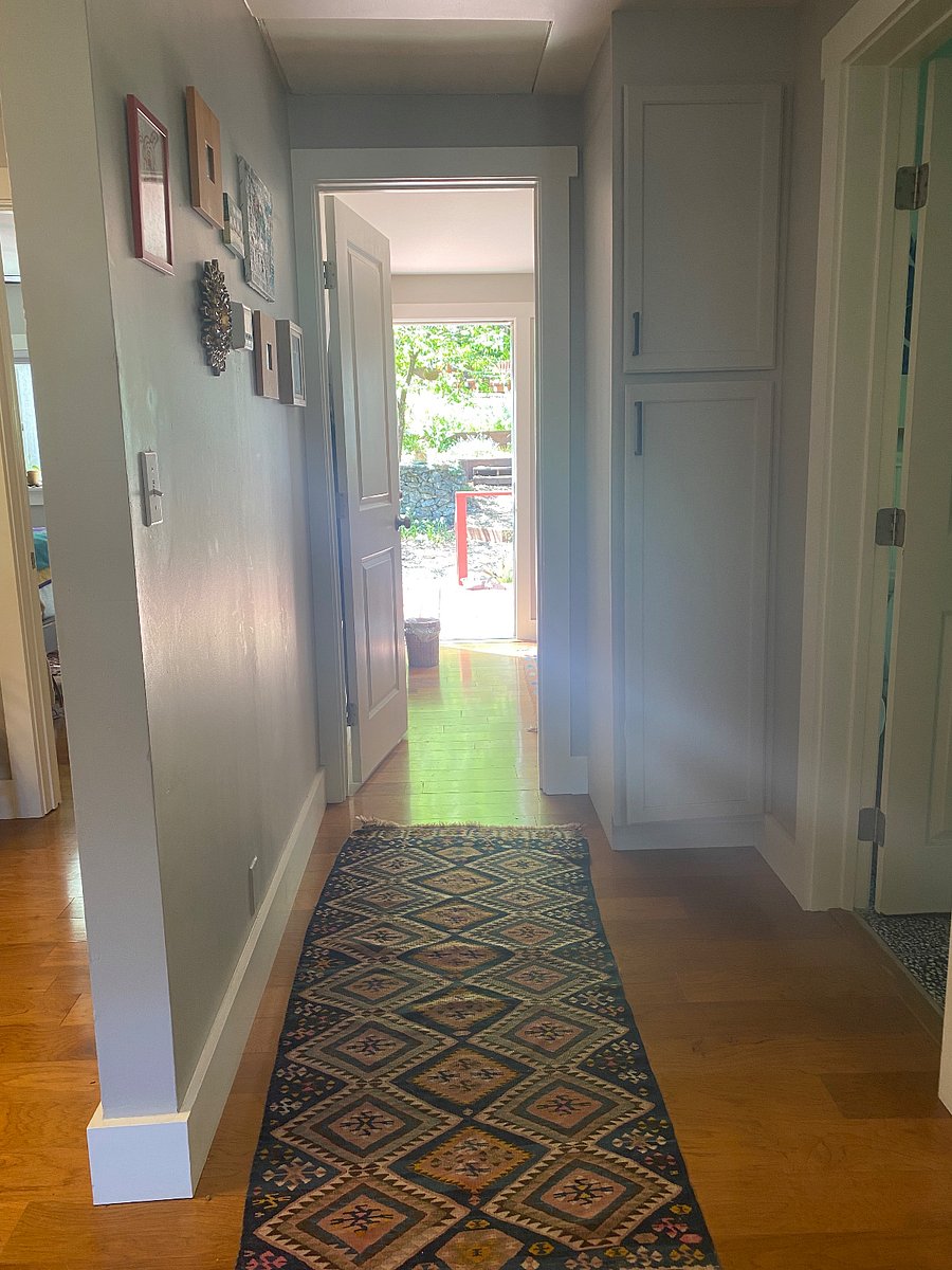 Hallway to the available bedroom with its own private entrance.