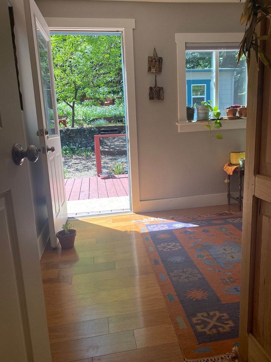 Bedroom 2 has its exit to the backyard