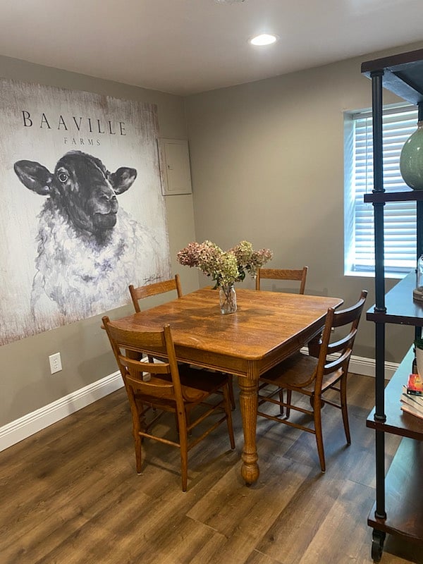 The dining room, infused with a charming county aesthetic, offers a cozy and inviting atmosphere and is perfect for meals.
