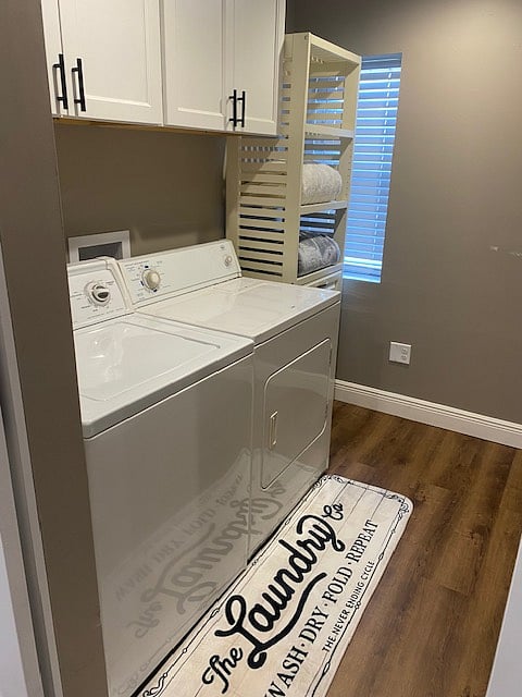 Behind the second barn door lies a spacious laundry area.