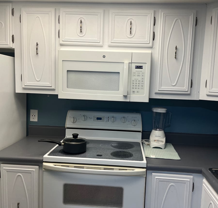 Fully stocked kitchen with a lot of cabinet space 