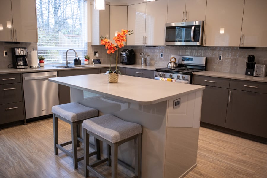 Modern kitchen design with window view of backyard