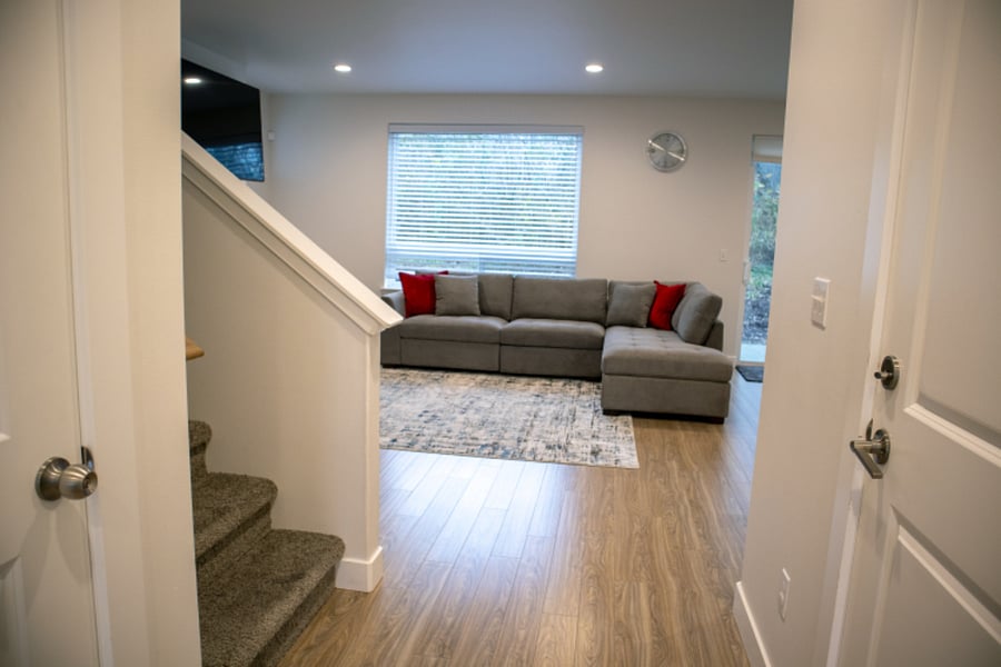 Entry hallway leads to open living room area