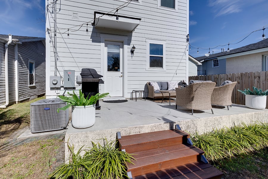 Back porch area - fully fenced in. Includes grill, propane fire pit and patio furniture.