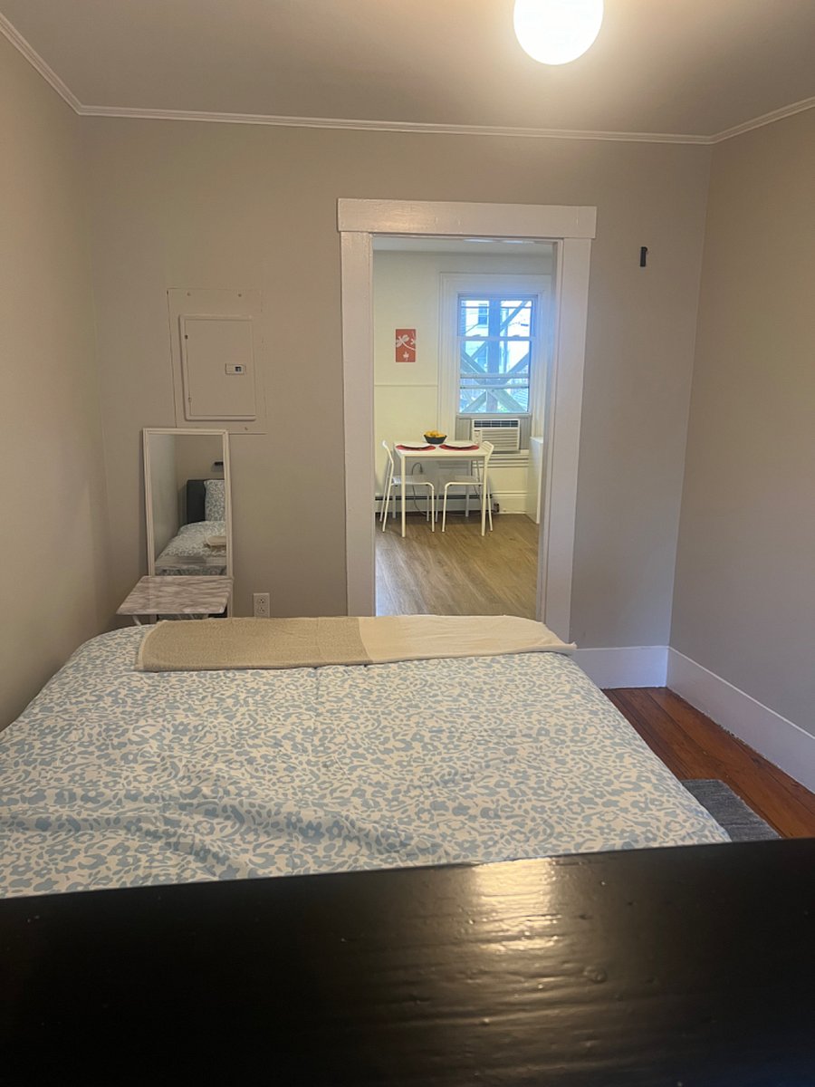 Bedroom with view into kitchen