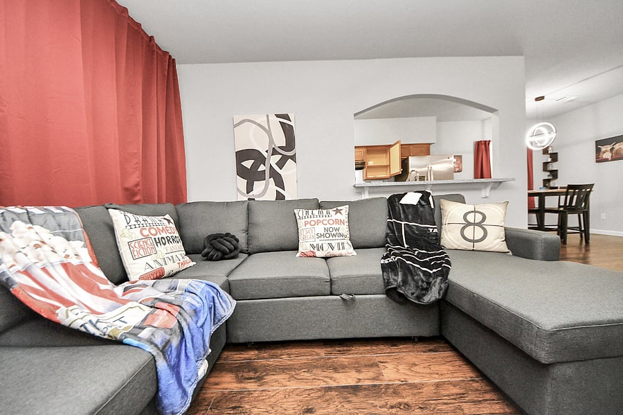 Unit B: Couch has a pull-out section to make for a Queen size sleeper, with additional storage under the chaise.