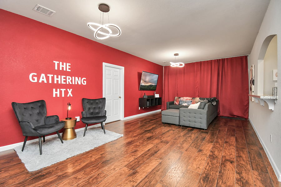 Unit B: Living room with sitting area and a family style couch with a pull-out section for additional sleeping.