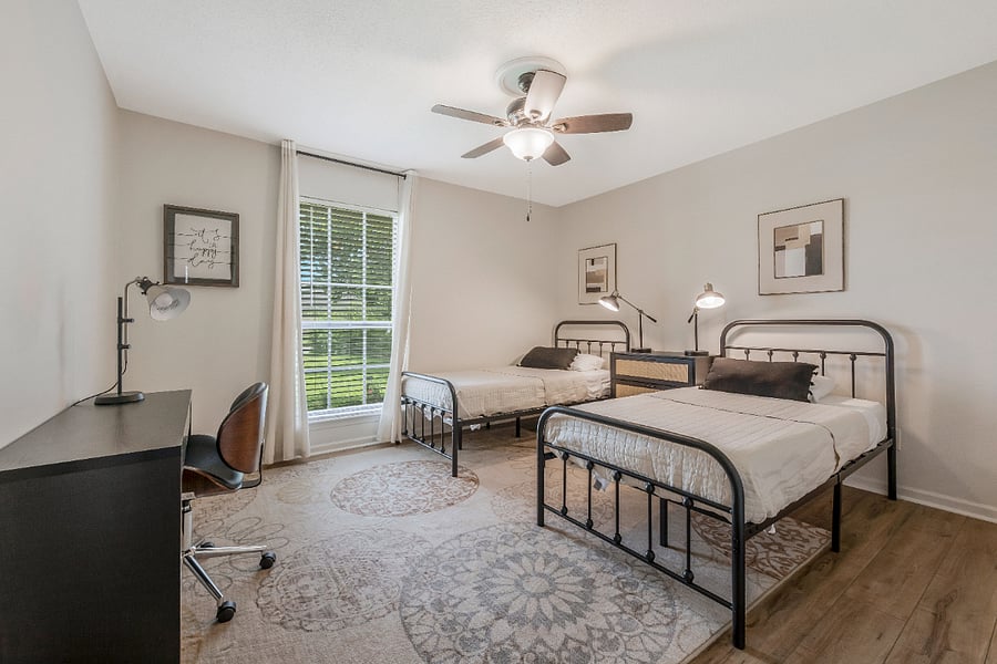 twin bedroom with desk