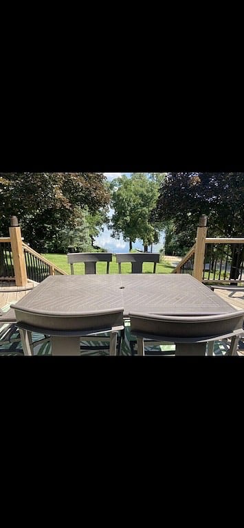 Front deck with propane grill, and table for six