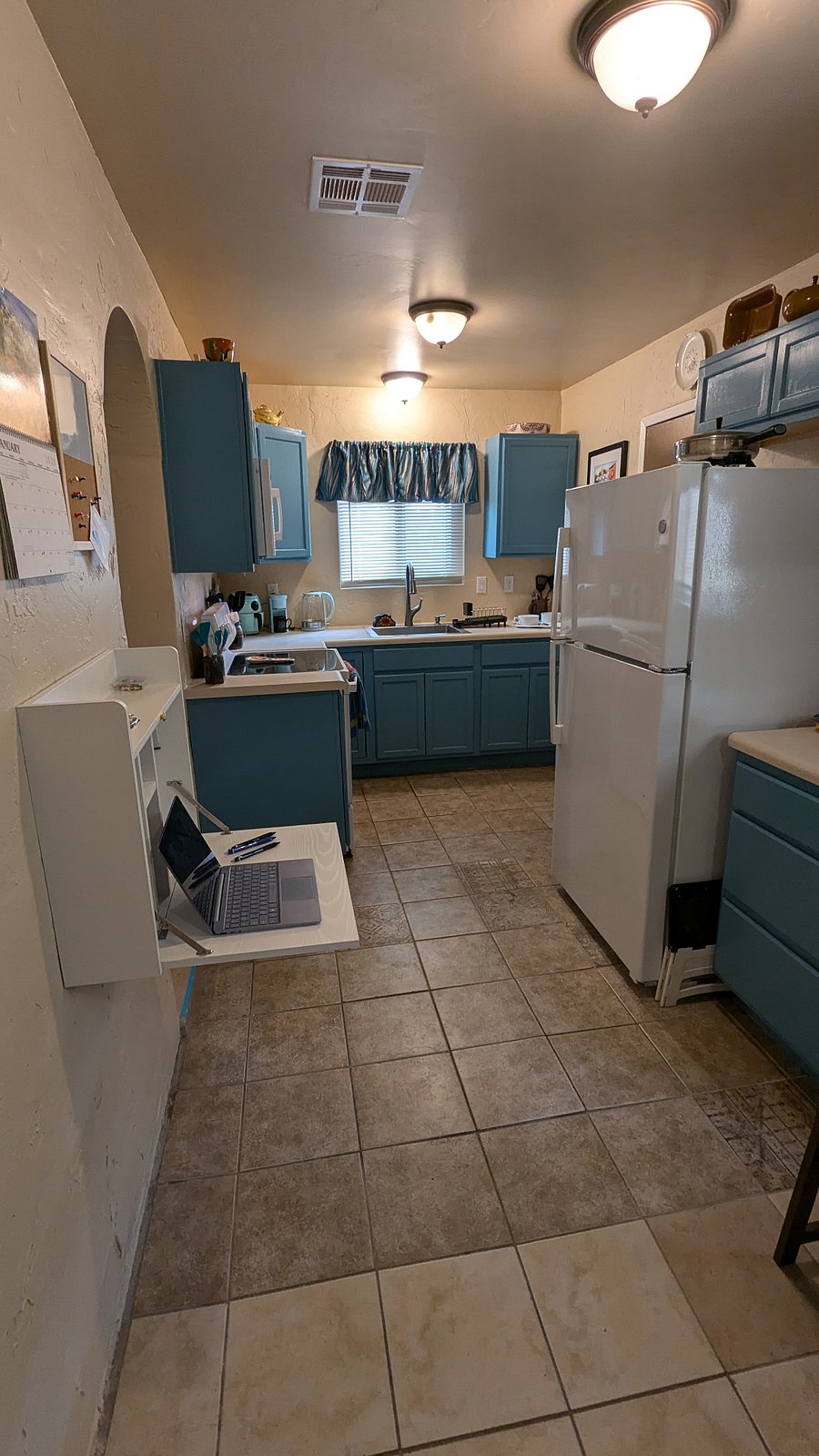 bold, bright kitchen with new range (has air fryer), microwave, refrigerator. Countertop electric kettle, coffee maker (drip and k-cup), toaster, small air fryer, electric fry pan.