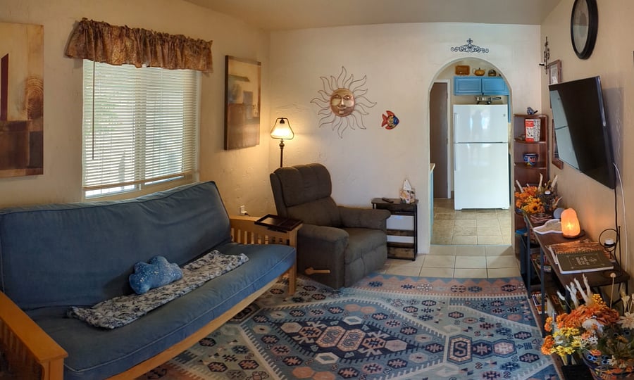 living room with comfy recliner and futon for couch