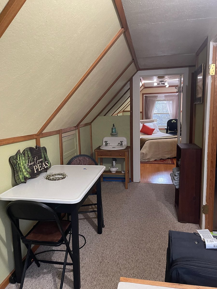 3rd Floor Suite including sink & kitchenette across hallway from table.