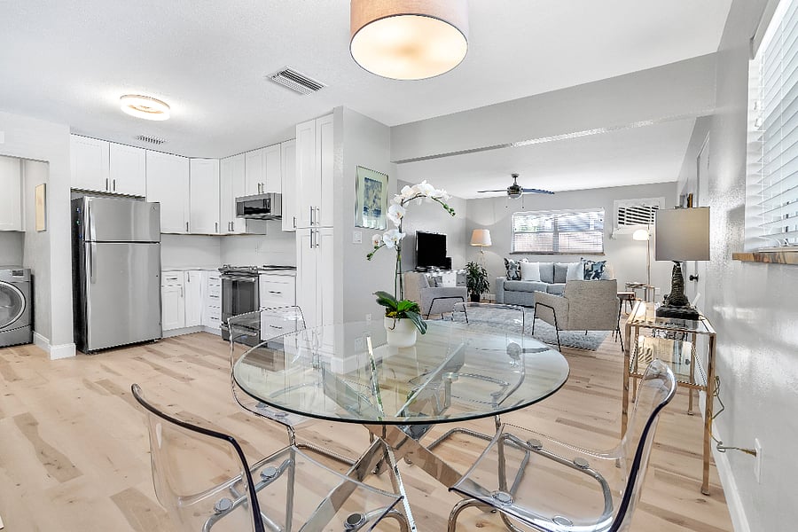 Dining area with views of kitchen and living room.