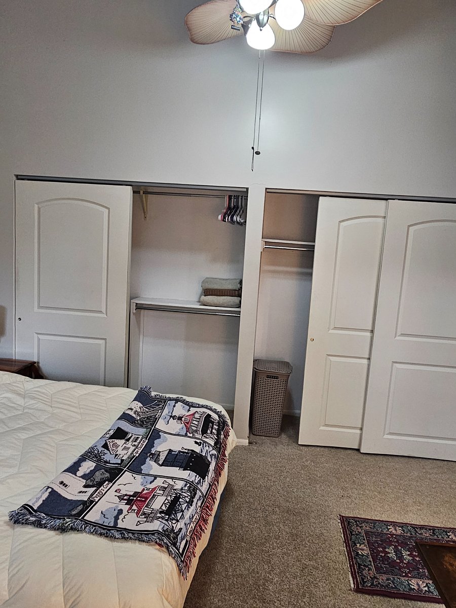 Large 6' sliding door closets in bedroom