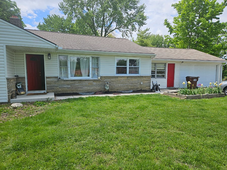 Private tenant entry right red door, near driveway.