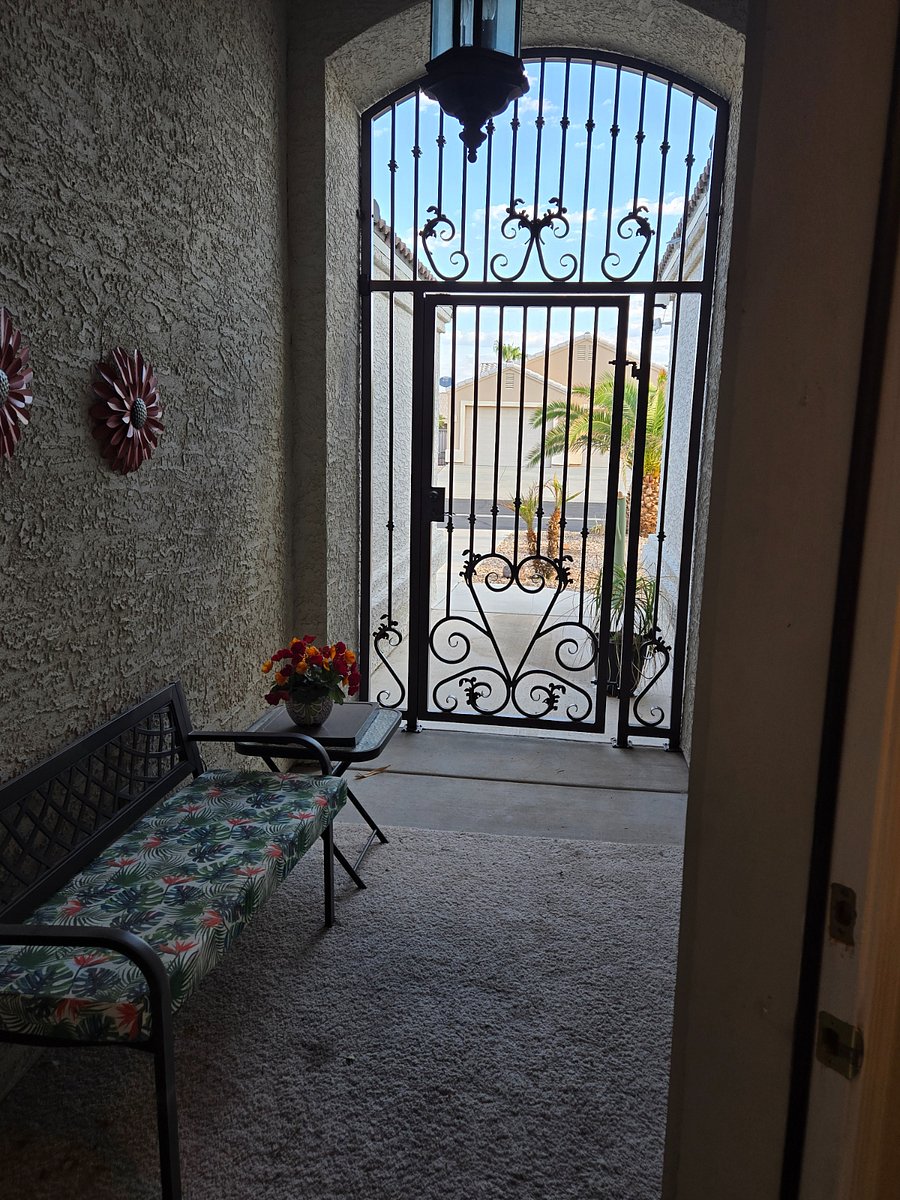 Front entry porch area with security gate.