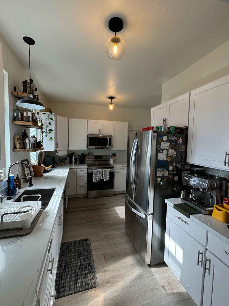 Shared kitchen with all new cabinets and quartz countertops. 