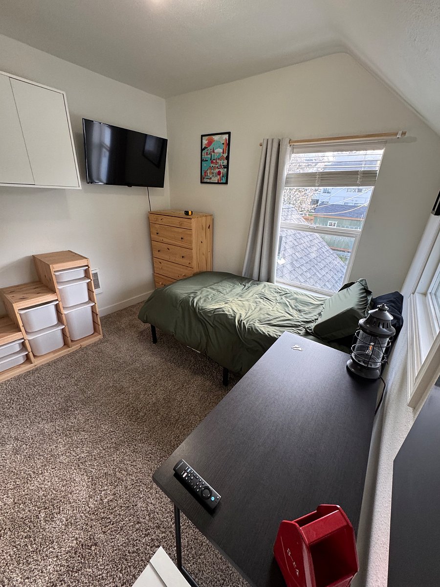 Upstairs room. Twin-size bed with space under bed for totes/boxes. Includes Smart TV.